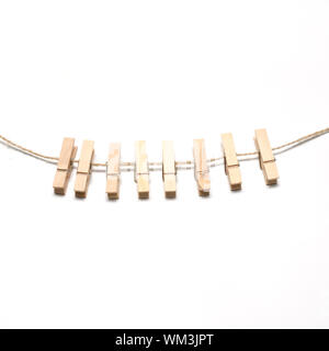 cloth pin hang with rope on a white background Stock Photo
