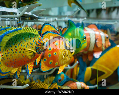 Colorful souvenir background. Hanging decoration in the market. Handmade  fish hanging on the tourist market. Sale of souvenirs. Funny handmade  fishes Stock Photo - Alamy