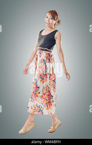 Attractive Asian woman with maxi dresses, full length isolated. Stock Photo
