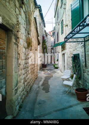 narrow street between historic tenements Stock Photo