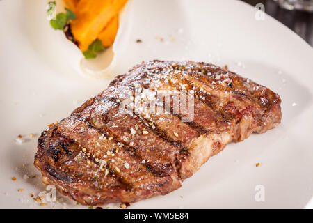 Grilled beef steak with seasoning Stock Photo