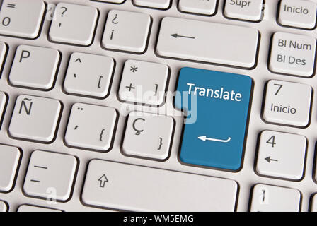 Spanish keyboard with language translate concept icon over blue background button.  Image with clipping path for easy change the key color and editing Stock Photo
