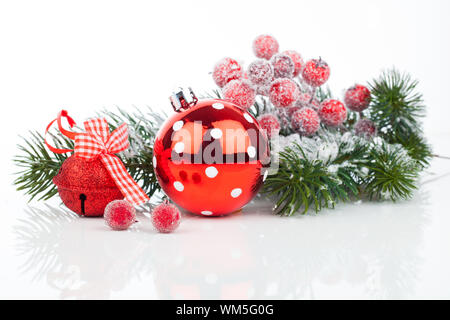 Christmas balls and fir branches with decorations isolated over white Stock Photo