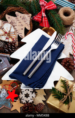 Christmas table place setting with christmas decorations Stock Photo