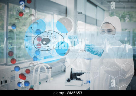 Scientist in protective suit working with cell diagram interface against dna helix in blue and red with ecg line Stock Photo