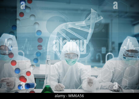 Chemists working in the lab with futuristic interface against dna helix in blue and red with ecg line Stock Photo