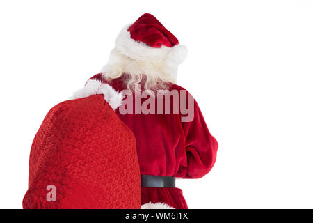 Santa carries his bag away on white background Stock Photo - Alamy