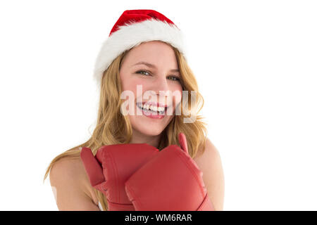 Smiling blonde wearing red boxing gloves on white background Stock Photo