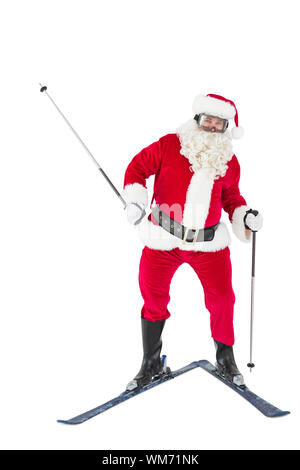 Portrait of happy santa claus skiing on white background Stock Photo