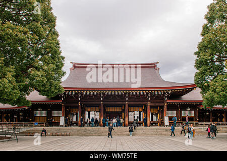 DEC 5, 2018 Tokyo, Japan - Meiji Jingu Shrine Historic Wooden main hall and shrine square with many tourists - Most important shrine of Japan capital Stock Photo