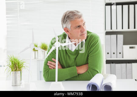 Casual businessman looking at away in his office Stock Photo