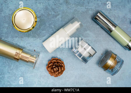 cosmetic product and tropical leaves on concert background, cosmetic product Stock Photo