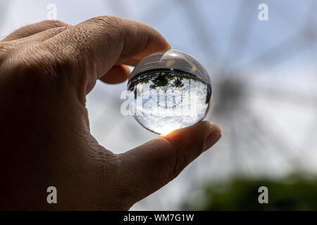 Ferris wheel in the Lens Ball, Philippines Stock Photo