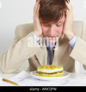 The young man was going to eat rotten meal Stock Photo