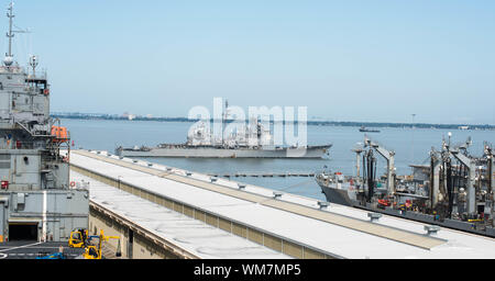 NORFOLK, Va. (Sept. 4, 2019) USS San Jacinto (CG-56) leaves Naval Station Norfolk in preparation of hurricane Dorian. This departure follows the announcement of Sortie Condition Alpha by Commander, U.S. 2nd Fleet. Stock Photo