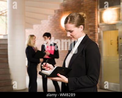 Woman reading her calendar Stock Photo