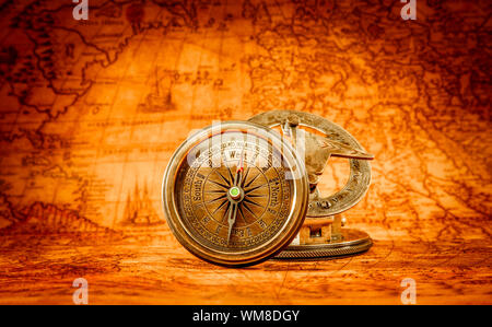 Compass lies on an ancient world map Stock Photo - Alamy