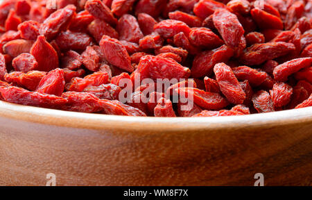 Wooden Bowl Full of Dried Goji Berries. Healthy Diet Stock Photo