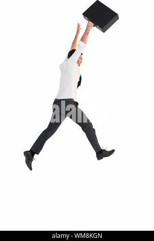 Businessman leaping with his briefcase on white background Stock Photo