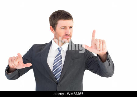 Focused businessman pointing with fingers on white background Stock ...
