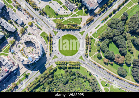 city street roundabout with little traffic of cars in summer time. aerial top view Stock Photo