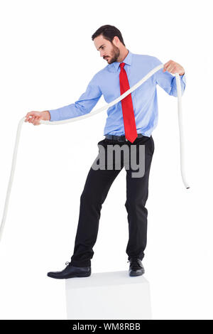 Focused businessman pulling a rope on white background Stock Photo - Alamy