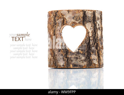 heart cut in hollow tree trunk. on white background Stock Photo