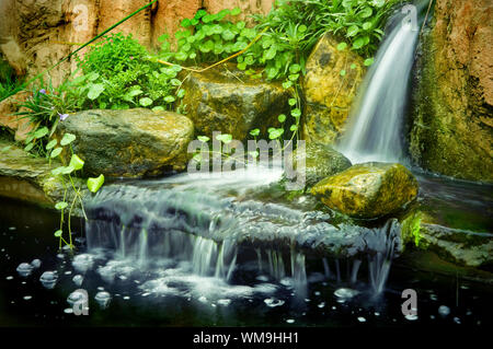 Japanese garden waterfalls, slow shutter. Stock Photo
