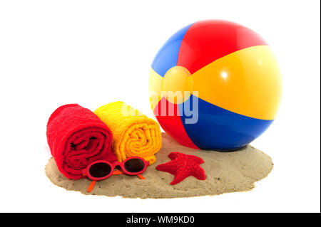 Plastic colorful ball in the sand for on the beach Stock Photo