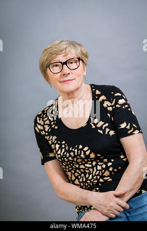 Attractive blond senior woman wearing glasses Stock Photo