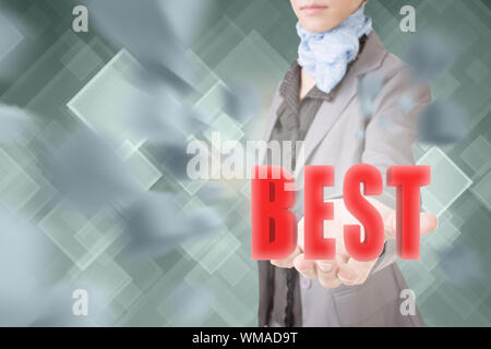 Concept of best, business woman holding a 3d text. Stock Photo