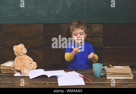 learning. enthusiastic and caring. Students are communicating on regular basis with the tutor. University male speaker conducts business training. Stock Photo