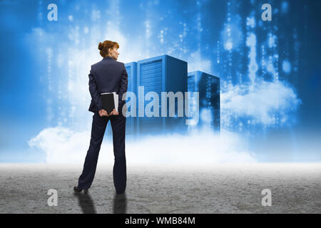 Businesswoman looking against cloud computing graphic with server Stock Photo