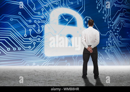 Businessman turning his back to camera against security graphic in desert setting Stock Photo