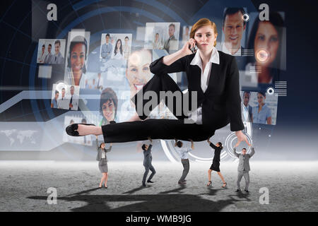 Business people supporting boss against interface with business profiles Stock Photo