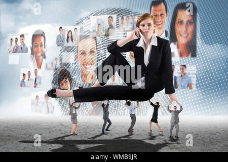 Business people supporting boss against business profiles with fingerprint Stock Photo