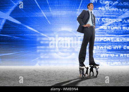 Business people supporting boss against blue technology interface Stock Photo