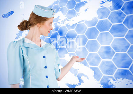 Pretty air hostess presenting with hand against background with europa map Stock Photo