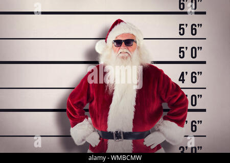 Santa Claus wears black sunglasses  against mug shot background Stock Photo