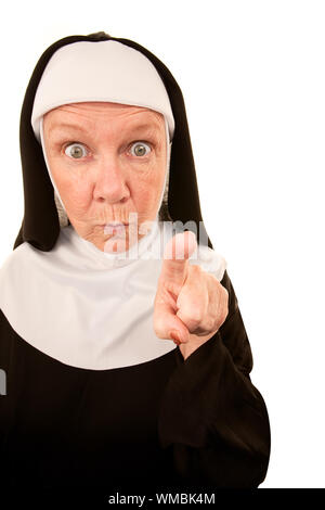 Intimidating funny senior nun pointing her finger Stock Photo