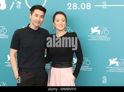 Venice, Italy. 4th Sep, 2019. Chinese actor Mark Chao (L) and actress Gong Li attend a photocall for the film 'Saturday Fiction' at the 76th Venice Film Festival in Venice, Italy, Sept. 4, 2019. Chinese film 'Saturday Fiction' is competing for the Golden Lion along with 20 other films at the 76th Venice Film Festival, running at the Lido of the lagoon city until Sept. 7. Credit: Cheng Tingting/Xinhua/Alamy Live News