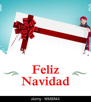 Composite image of couple holding a large sign against Christmas greeting card Stock Photo