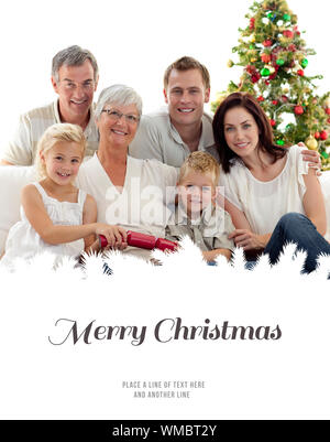 Children pulling crackers in Christmas against merry christmas Stock Photo