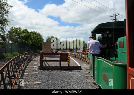 Driver reversing the engine at the Lartigue Monorail, unique heritage railway in Listowel, Co Kerry, Ireland.