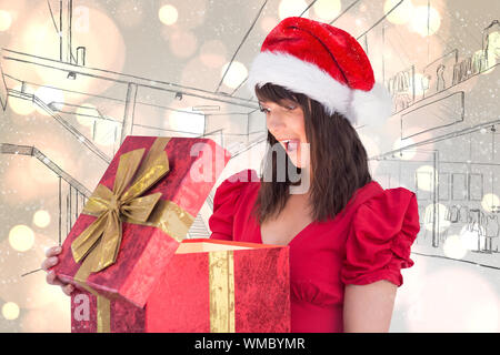 https://l450v.alamy.com/450v/wmbymr/surprised-festive-brunette-holding-a-gift-against-white-glowing-dots-on-grey-wmbymr.jpg