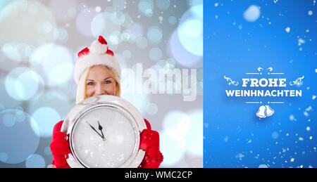 happy festive blonde with clock against blue vignette Stock Photo