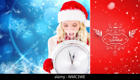 happy festive blonde with clock against red vignette Stock Photo