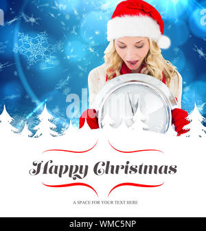 happy festive blonde with clock against border Stock Photo