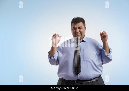 Obese man in formal clothes in frustrated mood Stock Photo