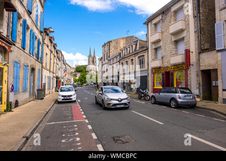 Niort, France - May 11, 2019: Steeples of the Saint-Andre church and street view of Niort, Deux-Sevres, France Stock Photo